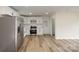 Modern kitchen featuring stainless steel appliances, white cabinets and new flooring at 510 Colony Acres Dr, Charlotte, NC 28217