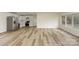 Open-concept living and kitchen area featuring new flooring and stainless steel appliances at 510 Colony Acres Dr, Charlotte, NC 28217