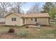 Home featuring a backyard patio for entertaining and a spacious, leafy yard at 515 Culloden Ct, Charlotte, NC 28214