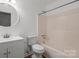 Neutral bathroom featuring a single sink vanity and a shower-tub combo at 515 Culloden Ct, Charlotte, NC 28214