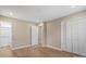 This bedroom offers modern flooring, neutral walls, a large closet, and an attached bathroom at 515 Culloden Ct, Charlotte, NC 28214