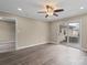Spacious bedroom with ceiling fan, modern flooring, and sliding glass doors to the outside at 515 Culloden Ct, Charlotte, NC 28214