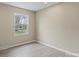 Neutral bedroom featuring wood-look floors and a bright window with natural light at 515 Culloden Ct, Charlotte, NC 28214