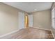 Neutral bedroom featuring wood-look floors, a double closet, and bright natural light at 515 Culloden Ct, Charlotte, NC 28214
