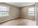 A room with modern flooring, windows, and neutral colored walls at 515 Culloden Ct, Charlotte, NC 28214