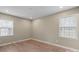 Bedroom features two large windows, neutral walls, and modern flooring at 515 Culloden Ct, Charlotte, NC 28214