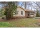 Home with brick and vinyl siding, set among mature shade trees at 515 Culloden Ct, Charlotte, NC 28214