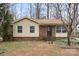 Single-story home with a mix of vinyl siding and brick, complemented by a simple, landscaped front yard at 515 Culloden Ct, Charlotte, NC 28214