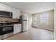 Modern kitchen with stainless steel appliances, subway tile backsplash, and new floors at 515 Culloden Ct, Charlotte, NC 28214