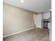Spacious open layout flows to the updated kitchen featuring stainless steel appliances and new floors at 515 Culloden Ct, Charlotte, NC 28214