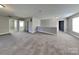 Large bonus room featuring neutral decor and plush carpet at 5513 Hammermill Dr, Harrisburg, NC 28075
