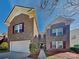 Charming brick home featuring a well-maintained yard and an attached two-car garage at 5513 Hammermill Dr, Harrisburg, NC 28075