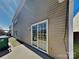 Exterior featuring a patio with sliding glass door and vinyl siding at 5513 Hammermill Dr, Harrisburg, NC 28075