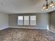 Bright living room with three windows and neutral paint, offering a comfortable living space at 5513 Hammermill Dr, Harrisburg, NC 28075