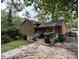 A rear view of a brick home with a deck at 5635 Ruth Dr, Charlotte, NC 28215