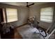 Bedroom with natural light, hardwood floors, and ceiling fan at 5635 Ruth Dr, Charlotte, NC 28215