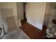 Bedroom features a hardwood floor, and neutral-colored walls at 5635 Ruth Dr, Charlotte, NC 28215