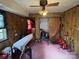 View of a cluttered bedroom featuring a window, doorway, and closet at 5635 Ruth Dr, Charlotte, NC 28215