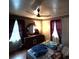 Bedroom with natural light, ceiling fan, and hardwood floors at 5635 Ruth Dr, Charlotte, NC 28215