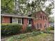 Charming two-story brick home featuring a landscaped yard and welcoming front entrance at 5635 Ruth Dr, Charlotte, NC 28215