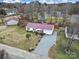 Aerial view of a single-Gathering home on a spacious lot with a large driveway at 609 Ben Rich St, Dallas, NC 28034