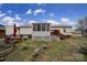 View of the cozy backyard featuring a deck, picnic table, and lovely goose statues at 609 Ben Rich St, Dallas, NC 28034