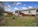 Spacious backyard with patio, shed, fire pit, and fenced yard with a grassy area at 609 Ben Rich St, Dallas, NC 28034