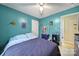 Inviting bedroom with blue walls, includes a ceiling fan and blue furnishings at 609 Ben Rich St, Dallas, NC 28034