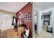Inviting hallway leading to a bright white front door, next to display of decorated wall and bar at 609 Ben Rich St, Dallas, NC 28034