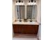 Bathroom featuring double vanity with black fixtures and framed mirrors at 645 Beaty St, Davidson, NC 28036