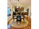 Cozy dining area with a bay window, cushioned seating, and kitchen access at 645 Beaty St, Davidson, NC 28036