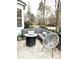 Outdoor patio with lounge seating, fire pit, and modern chair at 645 Beaty St, Davidson, NC 28036