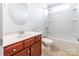 Bathroom with vanity and granite counters, tile flooring, and shower-tub combo at 7147 Brighton Park Dr, Mint Hill, NC 28227