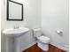 Bright powder room featuring a pedestal sink and stylish fixtures with updated design at 7147 Brighton Park Dr, Mint Hill, NC 28227