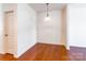 Dining room with wood floors and simple light fixture at 7147 Brighton Park Dr, Mint Hill, NC 28227