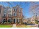 Charming brick townhome with lush green lawn and manicured landscaping, nestled in a beautiful neighborhood at 7147 Brighton Park Dr, Mint Hill, NC 28227
