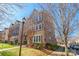 Attractive brick townhouse showcasing well-maintained landscaping and a welcoming neighborhood setting at 7147 Brighton Park Dr, Mint Hill, NC 28227