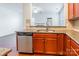 Modern kitchen with granite countertops, stainless steel appliances, tile backsplash and view to the Gathering room at 7147 Brighton Park Dr, Mint Hill, NC 28227