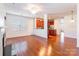 Open-concept living space with wood flooring and abundant natural light at 7147 Brighton Park Dr, Mint Hill, NC 28227
