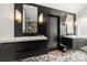 Modern bathroom featuring dual vanity, herringbone floor and dark accent walls at 7219 Morningdew Ct, Denver, NC 28037