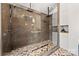 Large glass shower with dual shower heads and patterned tile floor in luxurious bathroom at 7219 Morningdew Ct, Denver, NC 28037