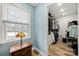 Walk-in closet featuring ample storage and well-organized shelving with a window at 7219 Morningdew Ct, Denver, NC 28037