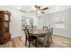 Cozy dining room featuring a rustic table and chairs with wood floors at 7219 Morningdew Ct, Denver, NC 28037