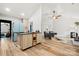 Open kitchen with center island, sleek appliances, and hardwood floors at 7219 Morningdew Ct, Denver, NC 28037