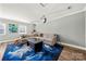 Spacious living room with comfortable seating, a large coffee table, and neutral tones at 7219 Morningdew Ct, Denver, NC 28037