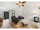 Inviting living area showcasing wood flooring, designer accent furniture, and abundant natural light at 7219 Morningdew Ct, Denver, NC 28037