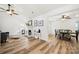 Inviting living room with fireplace, hardwood floors, and lots of natural light at 7219 Morningdew Ct, Denver, NC 28037