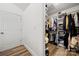Bright walk-in closet with shelving and clothing racks for ample storage at 7219 Morningdew Ct, Denver, NC 28037