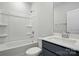 Clean bathroom featuring shower over bath, white sink and modern fixtures at 844 Westminster Dr, Statesville, NC 28677