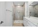 Modern bathroom featuring a tiled shower with glass enclosure and a white vanity at 844 Westminster Dr, Statesville, NC 28677